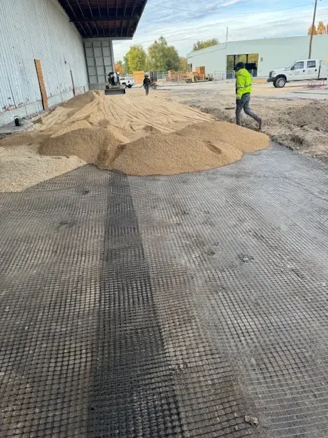 Road mix on top of fabric, prepping for concrete.